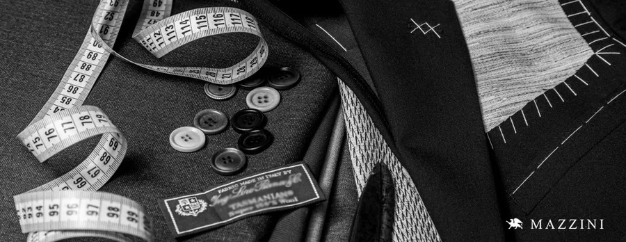 Mazzini men's suits brand cover photo showcasing premium suit fabric and intricate button detailing